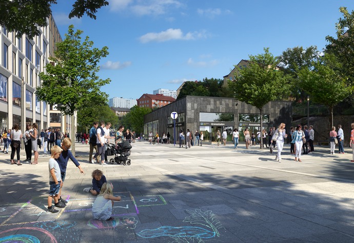 En gågata med människor, träd och barn som hoppar hage. Längst bort syns en mörkgrå byggnad med en tunnelbaneskylt utanför.